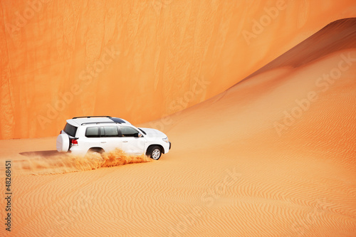 Fototapeta na wymiar 4 by 4 dune bashing is a popular sport of the Arabian desert