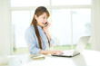 © one - Beautiful asian businesswoman using a laptop computer