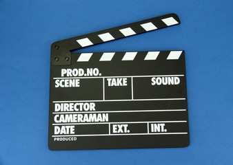 Movie production clapper board on color background