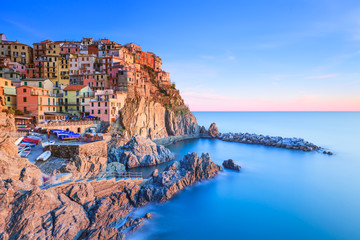 Wall Mural - Manarola village, rocks and sea at sunset. Cinque Terre, Italy