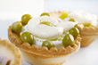 tartlet with salad on a white plate