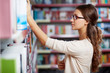 © pressmaster - Student in library