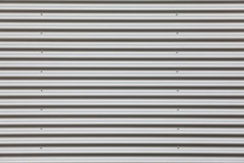 Wide Shot Of Silver Corrugated Metal With Bolts