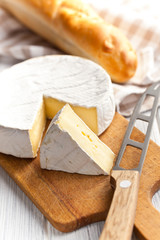 Wall Mural - camembert cheese on kitchen table