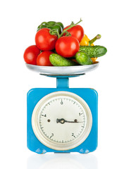 Healthy eating. Kitchen scale with vegetables isolated