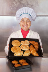 Baker with  pastries at bakery