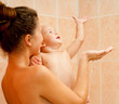 Mother and baby daughter in the shower