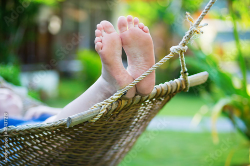 Valokuva Woman relaxing in hammock on a tropical resort