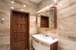 © TTstudio - bathroom in luxury home with bath and furniture