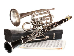 Sticker - antique trumpet, clarinet and case isolated on white