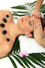 Poster - Portrait of beautiful woman with spa stones taking head massage