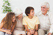 © WavebreakmediaMicro - Grandparents with grandchildren chatting