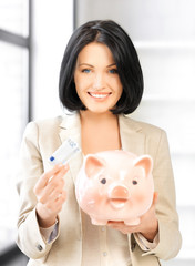 Wall Mural - lovely woman with piggy bank and money