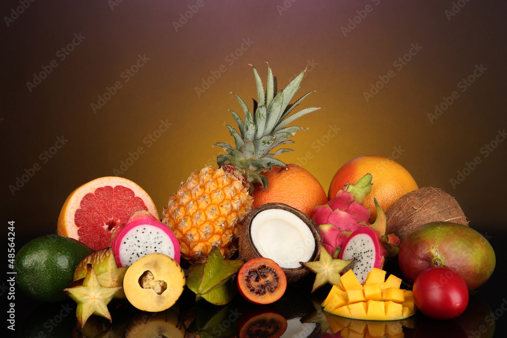 Composition of exotic fruits on colorful background