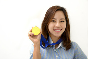 Young Businesswoman holds up her gold medal