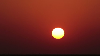 Wall Mural - timelapse with red sunset in desert