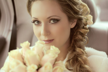 Beautiful bride woman portrait with bridal bouquet posing in her