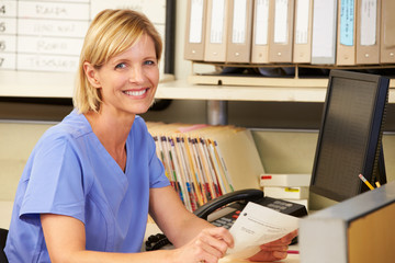 Wall Mural - Portrait Of Nurse Working At Nurses Station