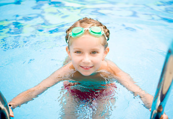 Little girl in swimming pool