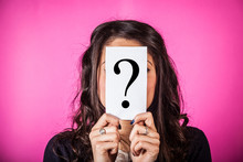 Doubtful Woman Holding Question Mark