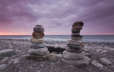 Sticker - Piling of rocks, beautiful ocean in the background