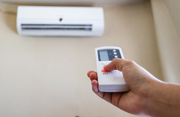 Closeup view about using some appliance such as air condition.