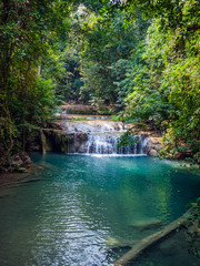 Wall Mural - Waterfall in the rainforest. Erawan National Park in Thailand.