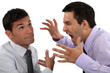 Man yelling at his apathetic colleague