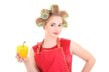 Wall Mural - beautiful housewife with hair curlers and yellow pepper