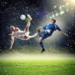 © Sergey Nivens - two football players striking the ball
