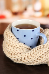 Poster - cup of tea with scarf on table in room