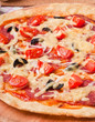 © timolina - pizza with salami and tomatoes