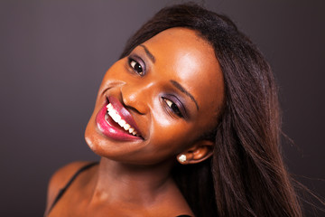 Wall Mural - happy young african american woman face closeup