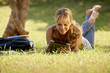 © Diego Cervo - Woman with books and tablet pc studying for college test
