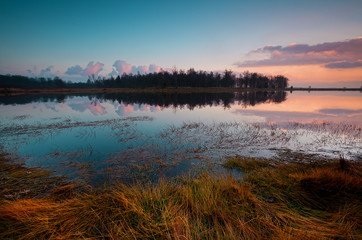 Fototapete - colorful sunset over peaceful lake
