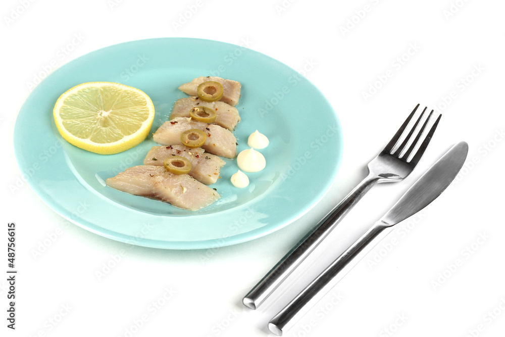 Dish of herring and lemon on plate isolated on white