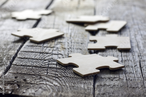 Naklejka dekoracyjna Puzzle on wooden boards team business concept