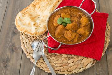 Wall Mural - Goan Pork Vindaloo - Indian pork curry with naan bread