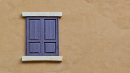 Wooden window on a house wall