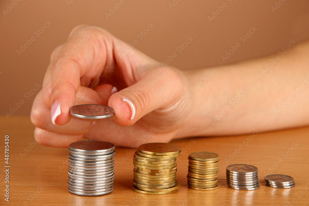 Woman hand with coins, close up