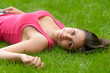 © Solid photos - Beautiful smiling girl lying on the grass
