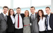 © opolja - Closeup portrait of a successful business team laughing together