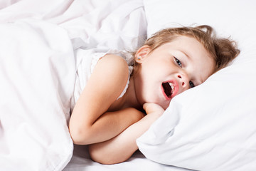 little girl yawning