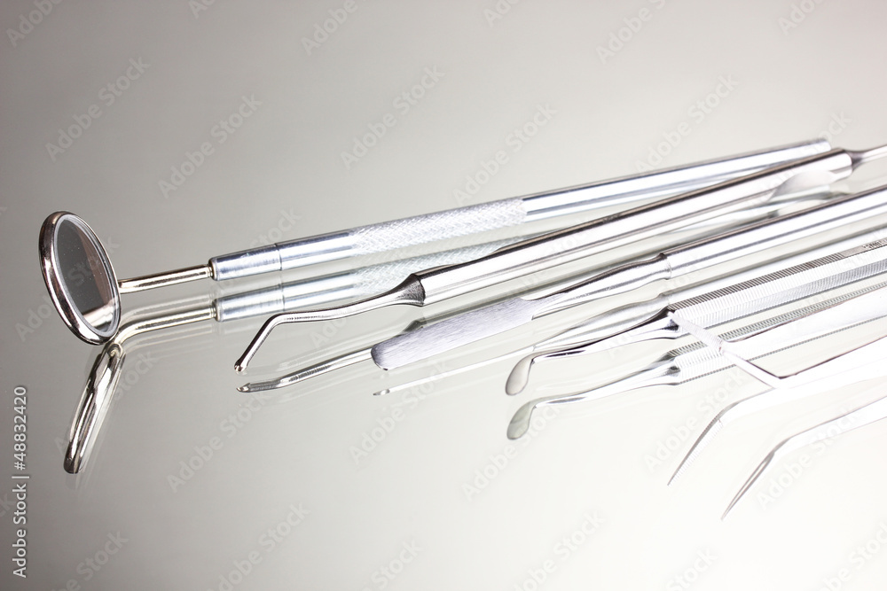 Set of dental tools for teeth care isolated on grey background