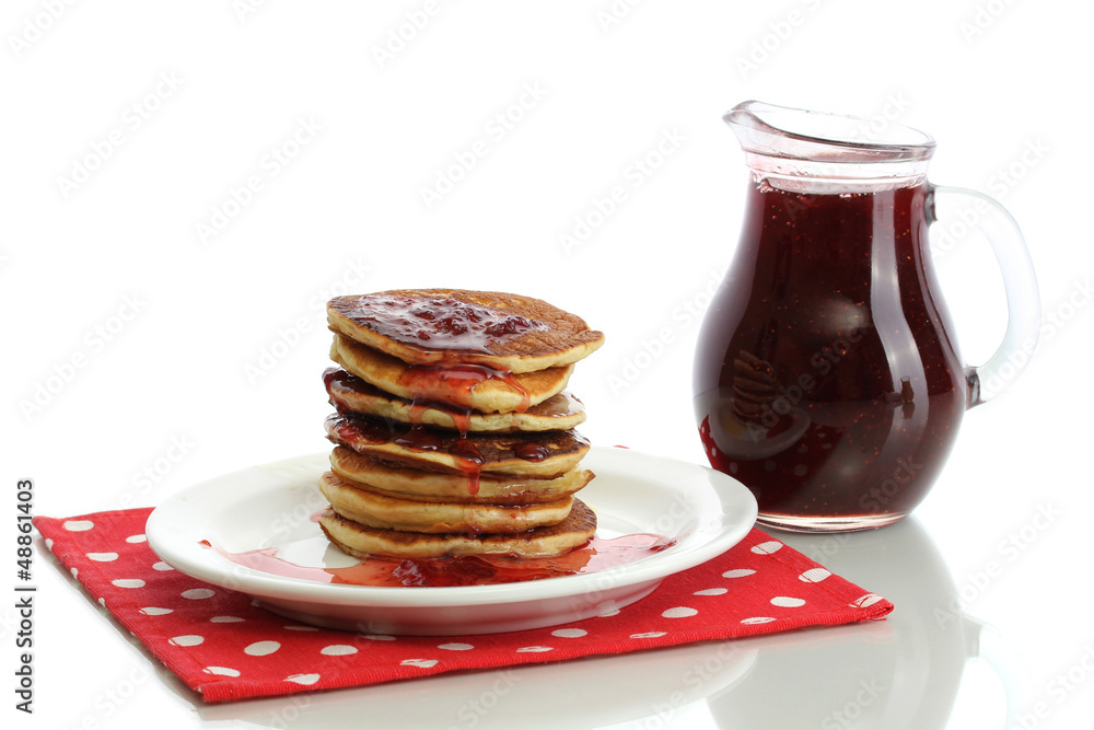 Sweet pancakes on plate with condensed milk isolated on white