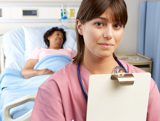 Wall Mural - Portrait Of Nurse With Patient In Background