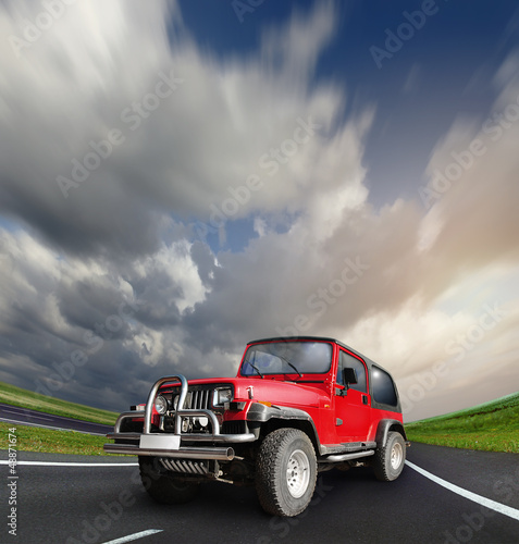 Naklejka - mata magnetyczna na lodówkę All-wheel drive car at the deserted highway