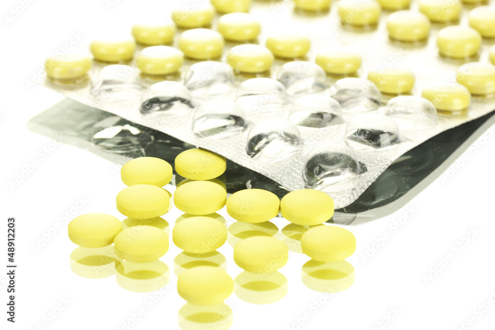 pills packed in blisters, isolated on white