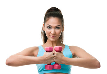 Wall Mural - Sportive woman works out with pink weights, isolated on white