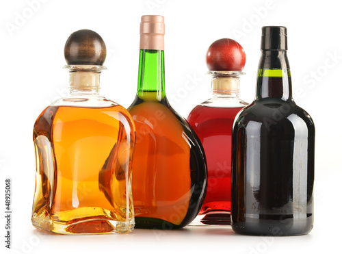 Naklejka dekoracyjna Composition with bottles of assorted alcoholic products isolated
